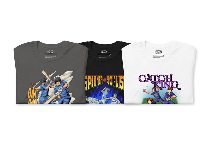 Three folded t-shirts with cricket-themed designs: a gray shirt featuring two batters with 'Bat Ball Wicket' text, a black shirt with bowlers and 'Spinner Specialist' text, and a white shirt with fielders and 'Catch King' text.