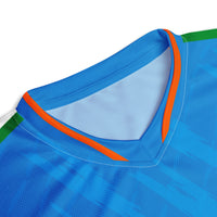 Close-up view of the V-neck collar of a blue sports jersey with orange and green accents