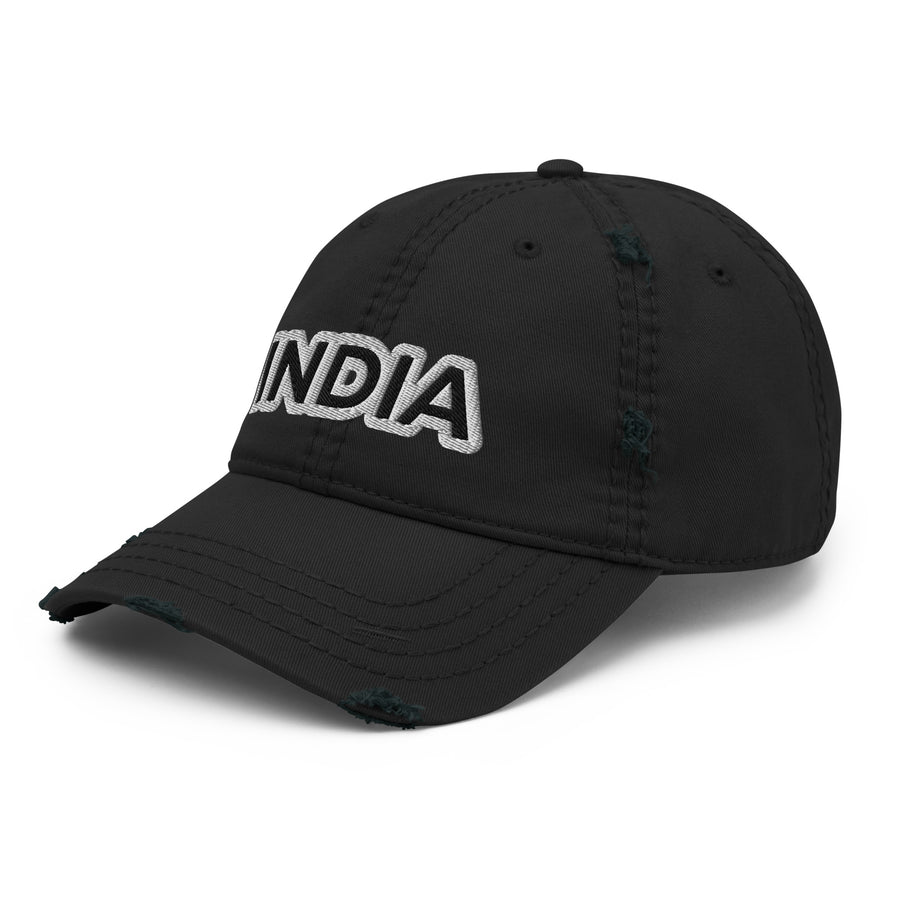 Front left angle view of the black distressed cap with white 'INDIA' embroidery, highlighting the frayed edges and vintage wear and tear.