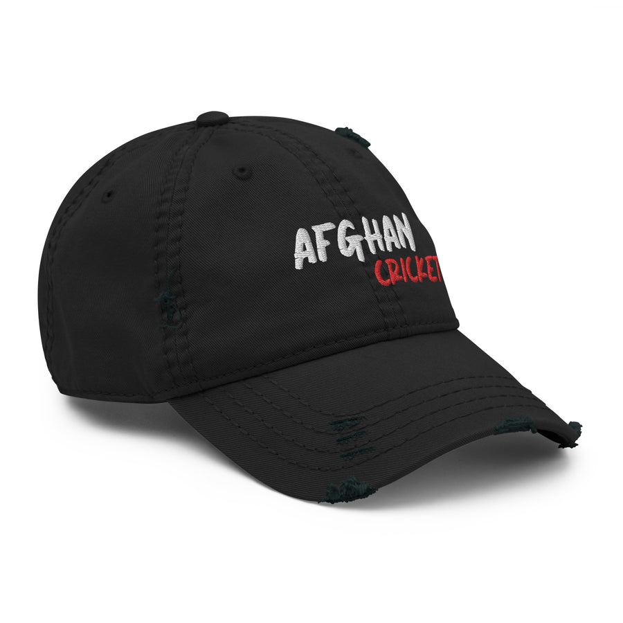 Distressed black cap with 'Afghan Cricket' embroidered in white and red on the front, viewed from the right side, showcasing a vintage appearance