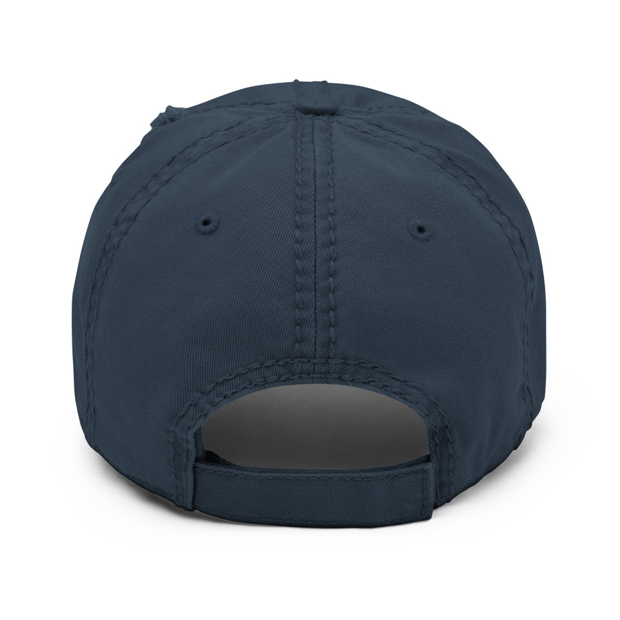 Back view of the navy distressed cap with an adjustable strap, emphasizing its one-size-fits-all design and rugged style.