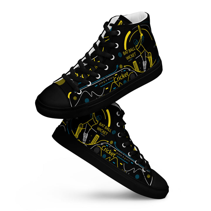 Angled side view of men's high-top canvas shoes featuring a black background with yellow, blue, and white cricket-themed artwork, including bats, balls, and the word "Cricket" in a stylized font.