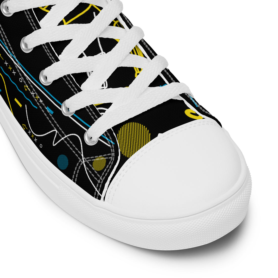 Close-up detail shot of the white high-top canvas shoes from Bat Ball Wicket, highlighting the cricket bat and ball illustrations with accents of yellow and blue.