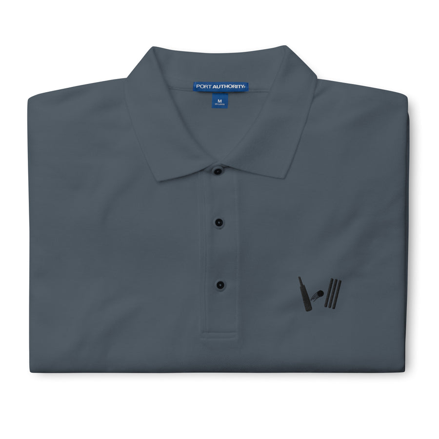 "Folded steel grey polo shirt displaying the Bat Ball Wicket logo on the left chest area and the Port Authority label on the collar, in medium size