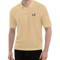 Model wearing a beige polo shirt with the Bat Ball Wicket logo embroidered on the left chest, representing a stylish cricket lifestyle