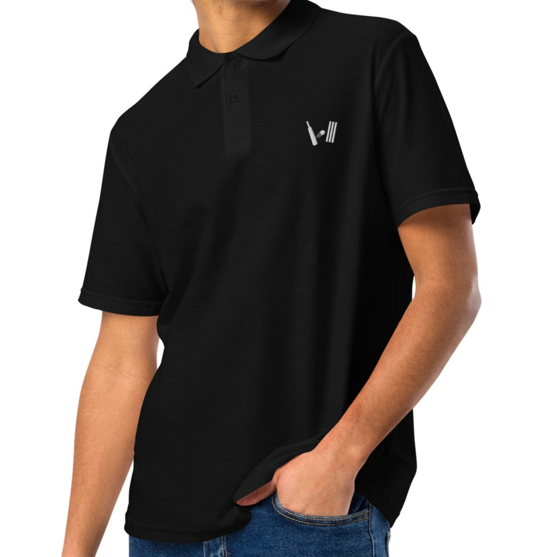 Side view of a man wearing a black polo shirt with distinctive white embroidery on the chest, paired with casual jeans for a sporty look.