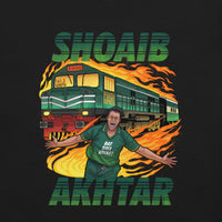 Front view of a black t-shirt featuring a detailed graphic of Shoaib Akhtar with a train and flames, emphasizing speed and energy, with 'Shoaib Akhtar' in prominent green lettering.